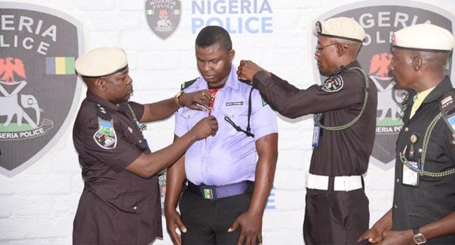 Nigerian Police Force Dismisses Officer Filmed Beating A Civilian With Machete (Photo), Nigerian Police Force Dismisses Officer Filmed Beating A Civilian With Machete (Photo), INFINITY LOADED